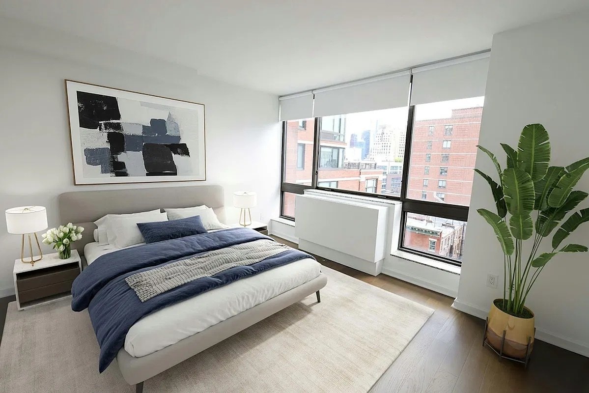 Sunlit bedroom with Midtown views