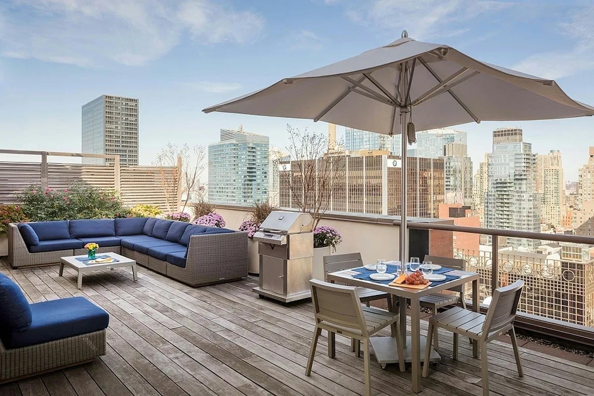 Landscaped rooftop terrace with city views